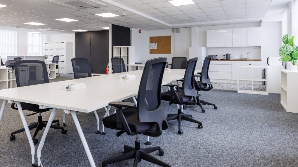 Bright, naturally lit office breakout space designed for informal team collaboration